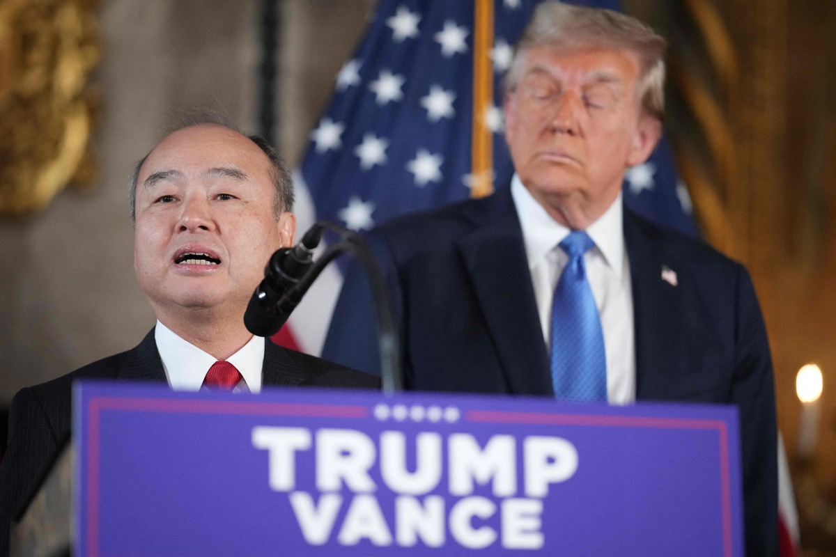 Softbank CEO Masayoshi Son delivers remarks alongside U.S. President-elect Donald Trump at Trump's Mar-a-Lago resort on December 16, 2024 in Palm Beach, Florida. (Photo by Andrew Harnik / GETTY IMAGES NORTH AMERICA / Getty Images via AFP)
