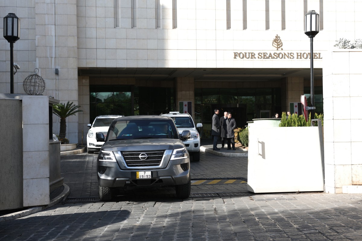 Cars belonging to the US delegation exit a hotel in Damascus on December 20, 2024. Photo by OMAR HAJ KADOUR / AFP.
