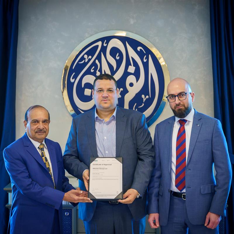 Alfardan Group executives with the certificate.
