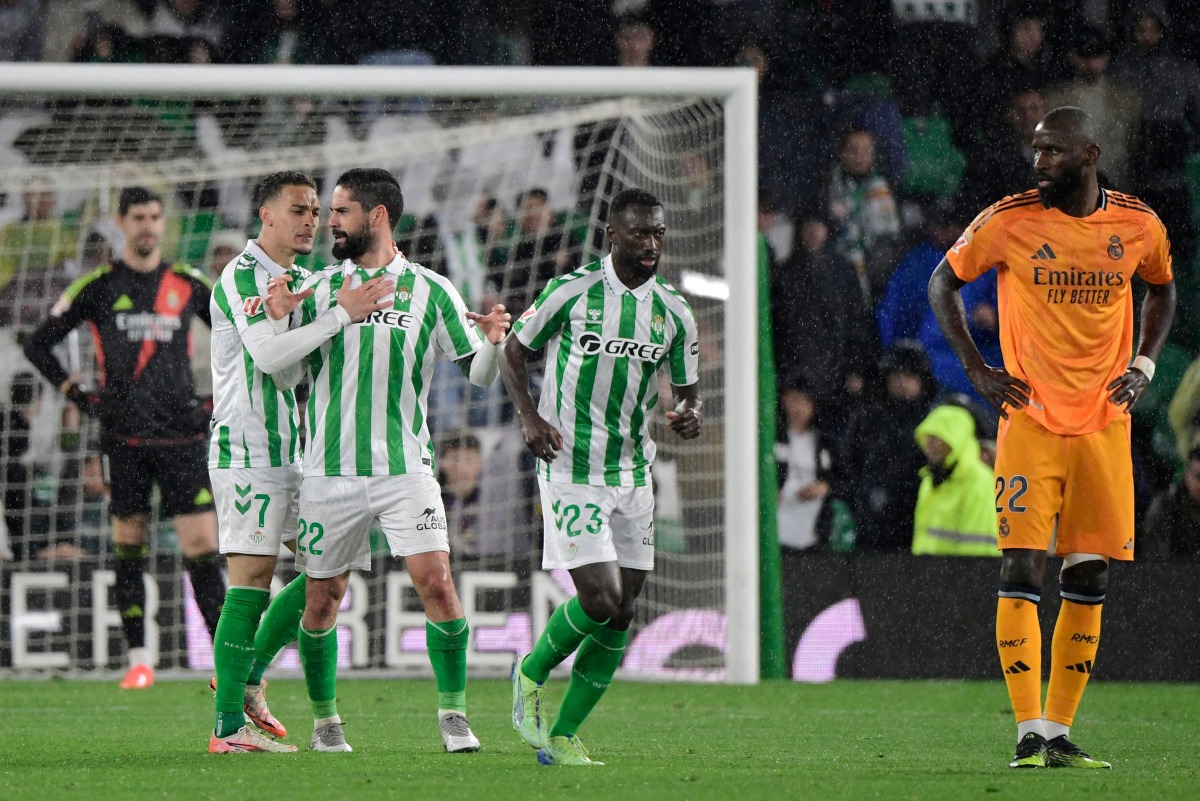Real Betis' Spanish midfielder #22 Isco celebrates scoring his team's second goal during the Spanish league footbal match between Real Betis and Real Madrid CF at Benito Villamarin Stadium in Seville on March 1, 2025. (Photo by CRISTINA QUICLER / AFP)