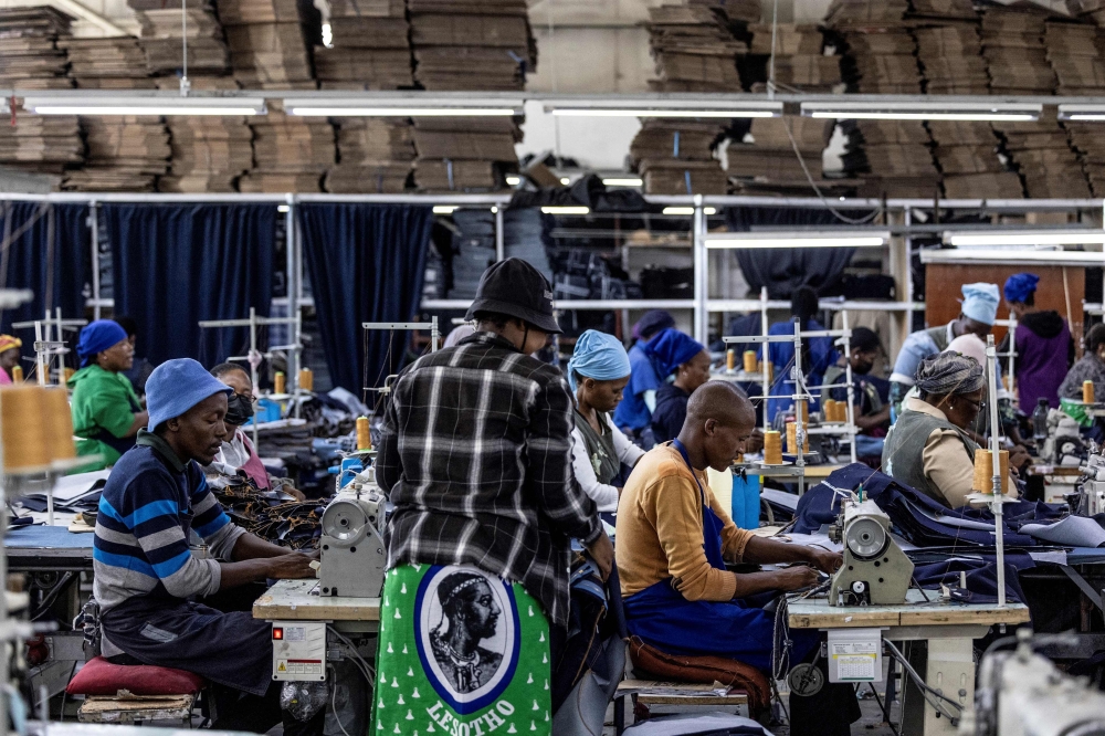 Workers use sewing machines at the Afri-Expo Textile Factory in Maseru, Lesotho on March 19, 2025. (Photo by Roberta Ciuccio / AFP)
