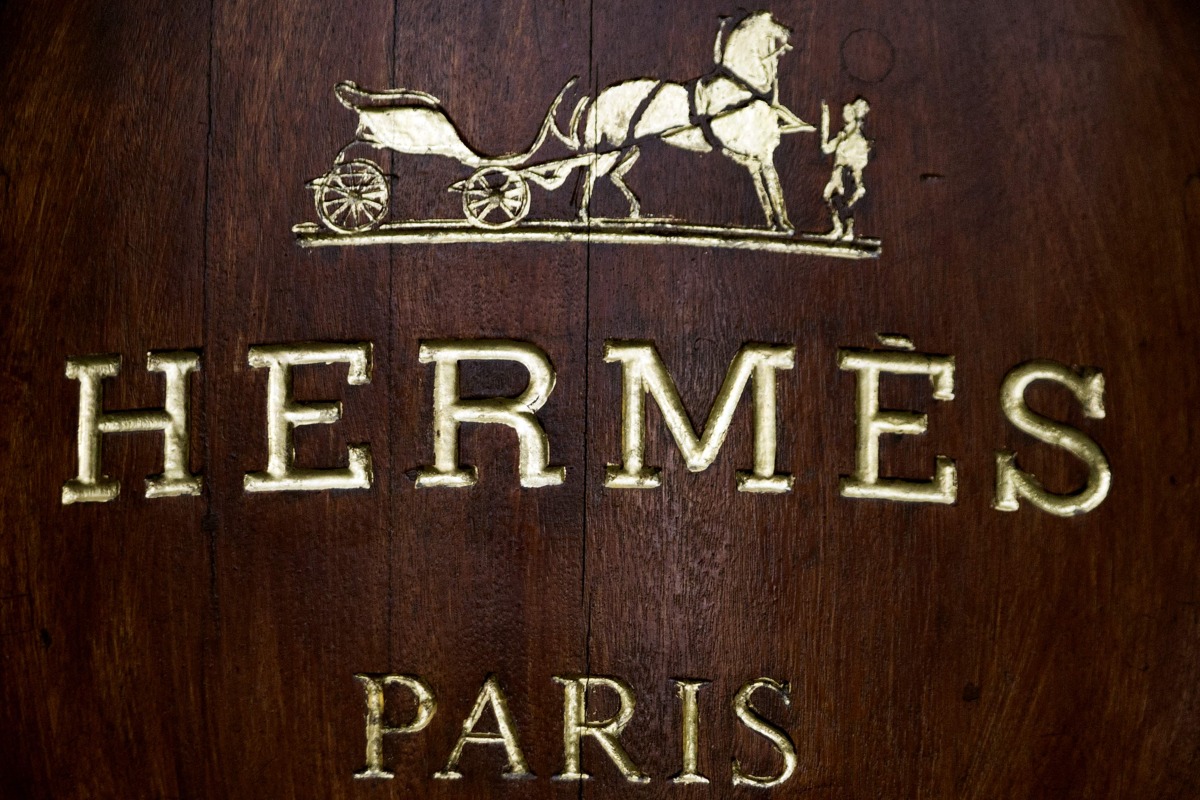 The Hermes store name is pictured above the facade of a shop, on December 26, 2012 in Paris. AFP PHOTO / JOEL SAGET