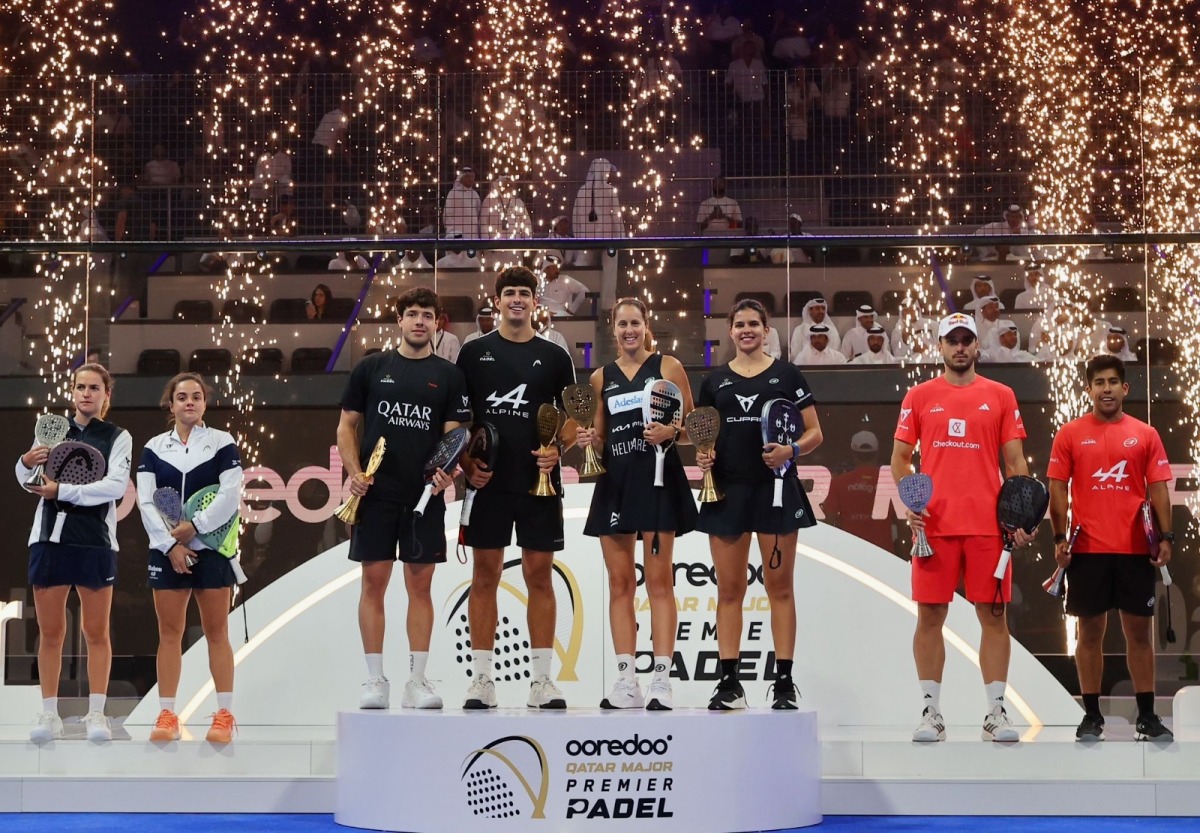 Men’s champions Arturo Coello and Agustin Tapia pose for a photo with women's title winners Gemma Triay Pons and Delfina Brea Sensei on the podium.