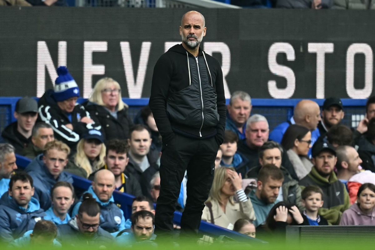 Manchester City's Spanish manager Pep Guardiola looks on during the English Premier League football match between Everton and Manchester City at Goodison Park in Liverpool, north west England on April 19, 2025. Photo by Paul ELLIS / AFP.