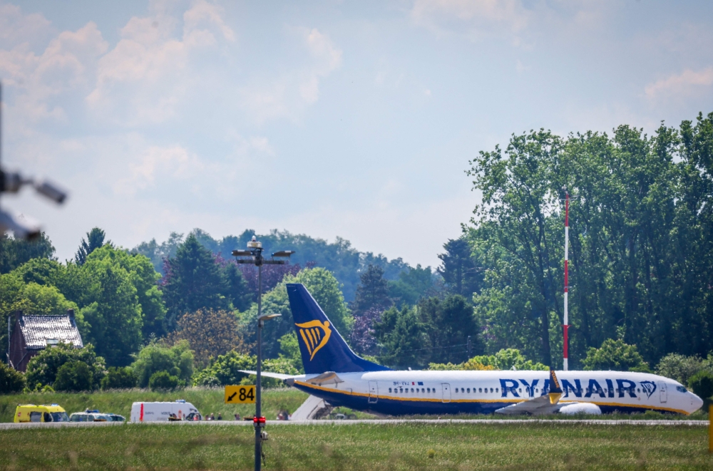 A Ryanair airplane coming from Porto is at standstill on the runway after a bomb alert at the Brussels South Charleroi Airport (BSCA) in Gosselies, on May 13, 2025. (Photo by VIRGINIE LEFOUR / Belga / AFP)