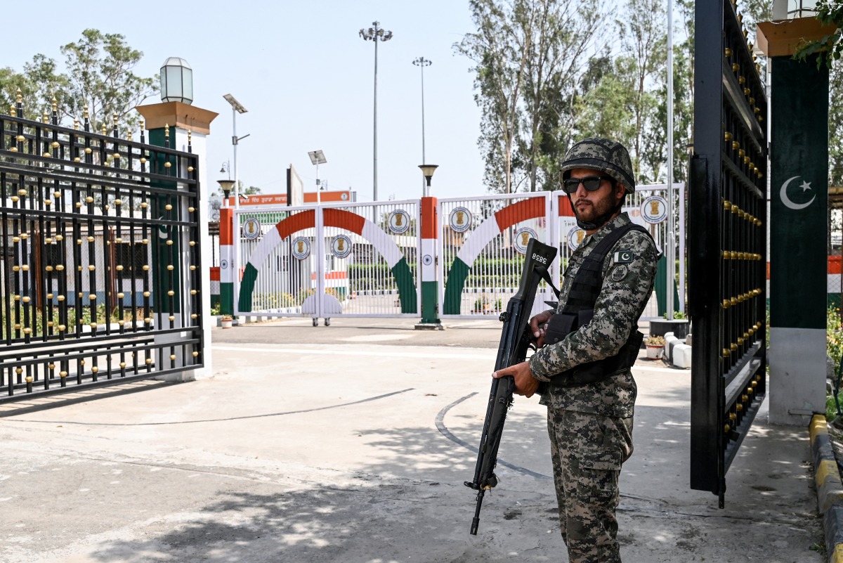 Photo used for representational purposes. A Pakistan Ranger stands guard at the Kartarpur Sahib Corridor complex, which runs along the India-Pakistan border in Kartarpur, on May 22, 2025. Photo by Arif ALI / AFP.