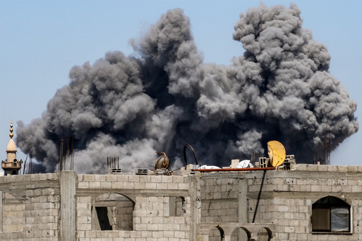 A cloud of smoke erupts from Israeli bombardment in the Bureij camp for Palestinian refugees in the central Gaza Strip on May 23, 2025. (Photo by Eyad BABA / AFP)
