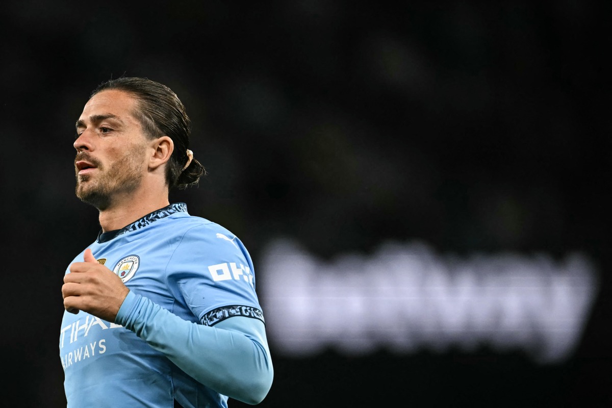 Manchester City's English midfielder #10 Jack Grealish enters the pitch during the English Premier League football match between Manchester City and Bournemouth at the Etihad Stadium in Manchester, north west England, on May 20, 2025. (Photo by Paul ELLIS / AFP)