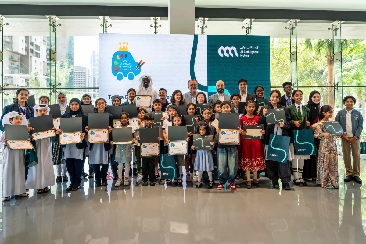 Al Abdulghani Motors representatives along with Qatari athletes, Ali Arshid, and Cherif Younousse pose for a group photo with the winners.