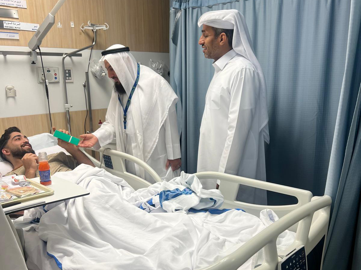 The center officials visiting a patient at a hospital.