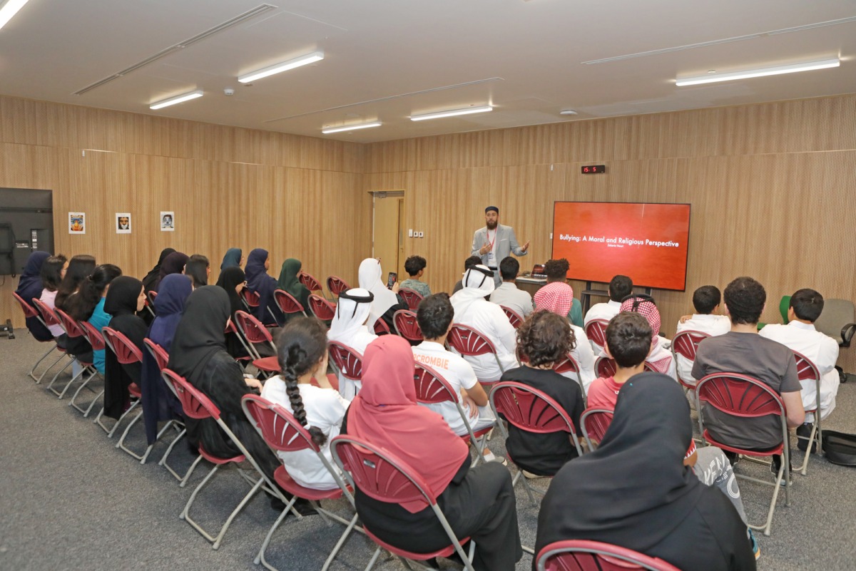 Students attend a lecture by Islamic Cultural Center at a school. 