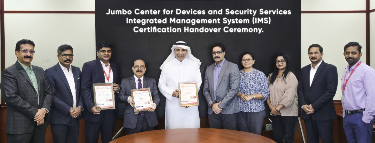 Jumbo Center for Devices and Security Services officials with the certifications during the ceremony.