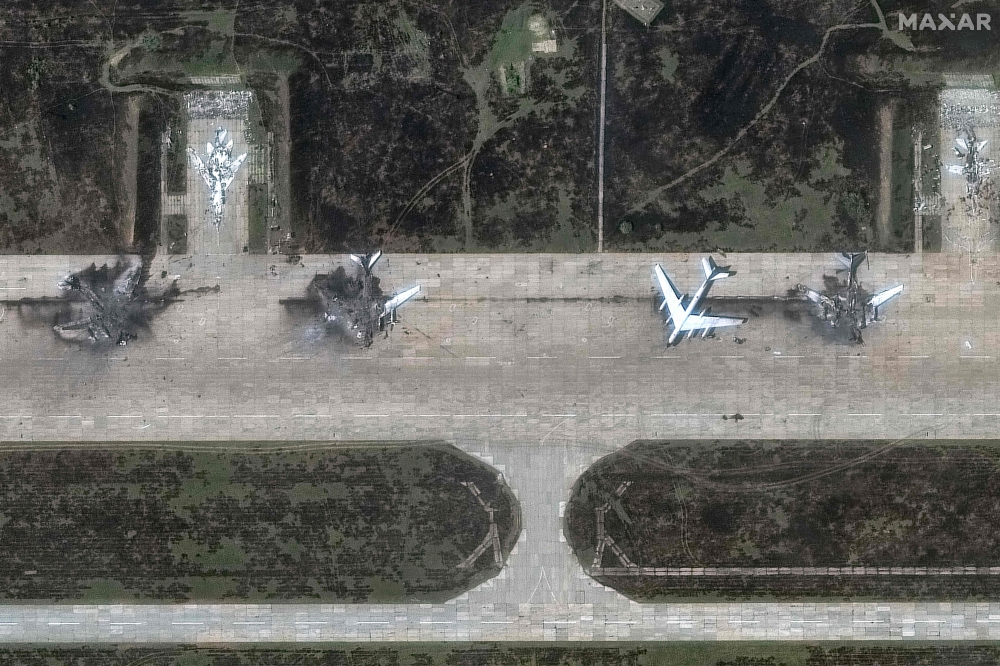 This handout satellite picture courtesy of Maxar Technologies released on June 4, 2025 shows destroyed Tupolev Tu-95 aicrafts at Belaya Airbase near Usolye-Sibirskoye in the Irkutsk Oblast. (Photo by Satellite image ©2025 Maxar Technologies / AFP) /