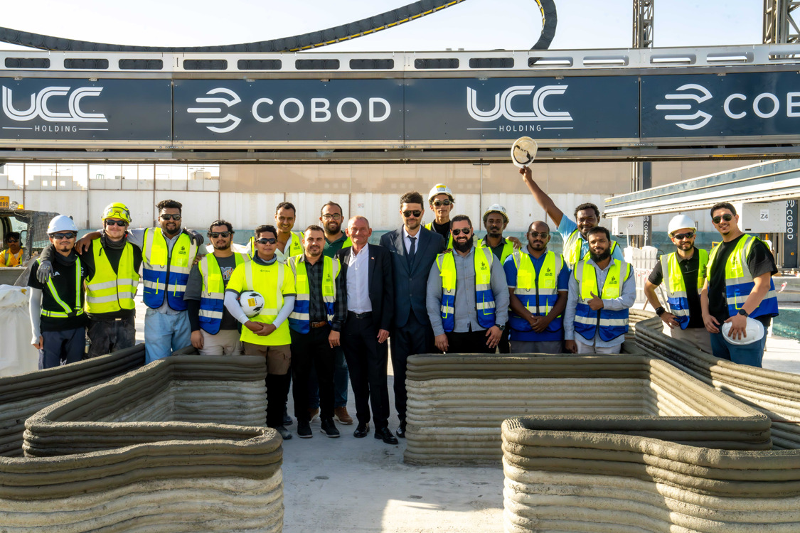 Officials and staff during the unveiling of the 3D construction printer. 
