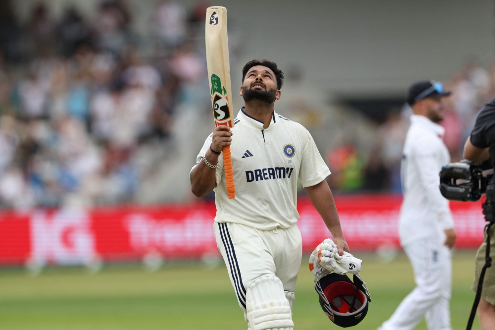 India's Rishabh Pant reacts as he walks back to the pavilion having lost his wicket for 134 on June 21, 2025. (Photo by Darren Staples / AFP) 