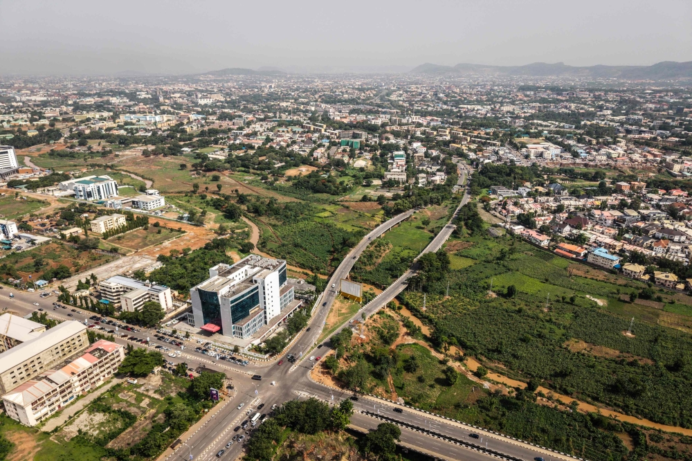 This aerial view shows urban farms in Abuja Central Business District, in Nigeria, on May 23, 2025. (Photo by Olympia De Maismont / AFP)