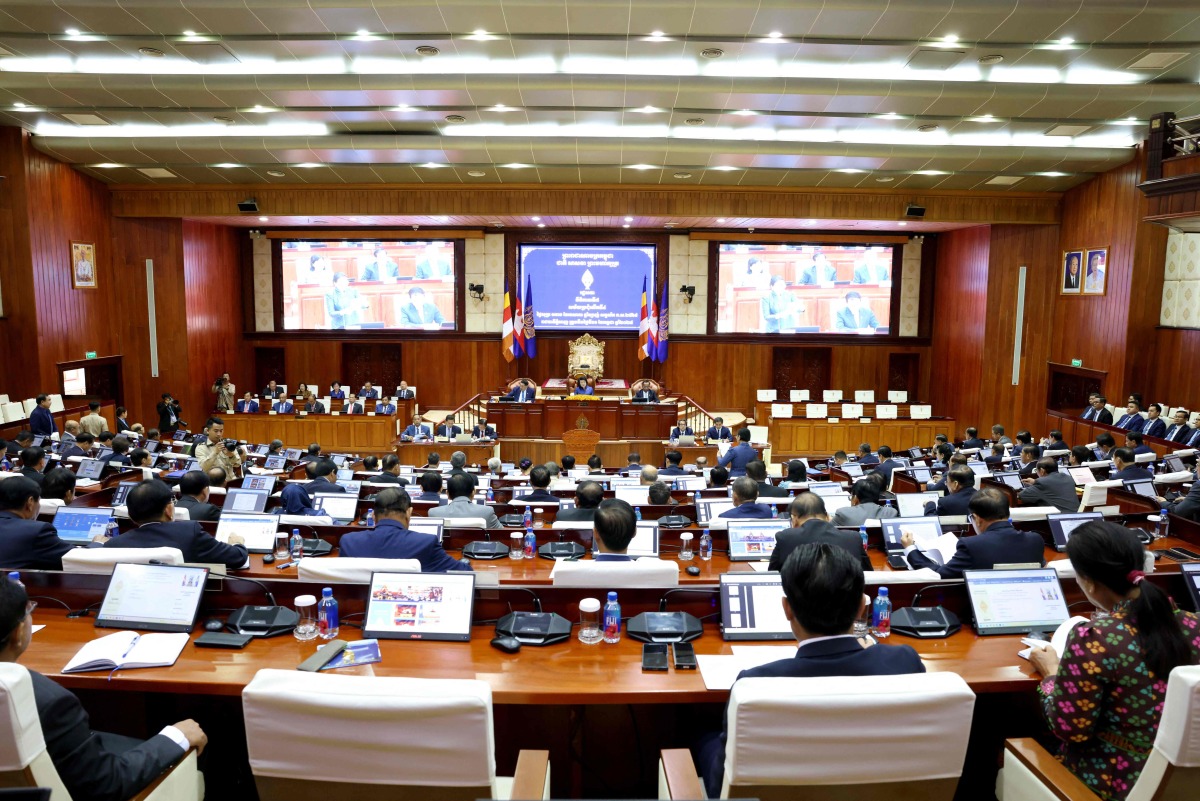 This handout photo taken and released by the Cambodia National Assembly on July 11, 2025 shows members of parliament attending a meeting at the National Assembly building in Phnom Penh. (Photo by Handout / CAMBODIA NATIONAL ASSEMBLY / AFP)