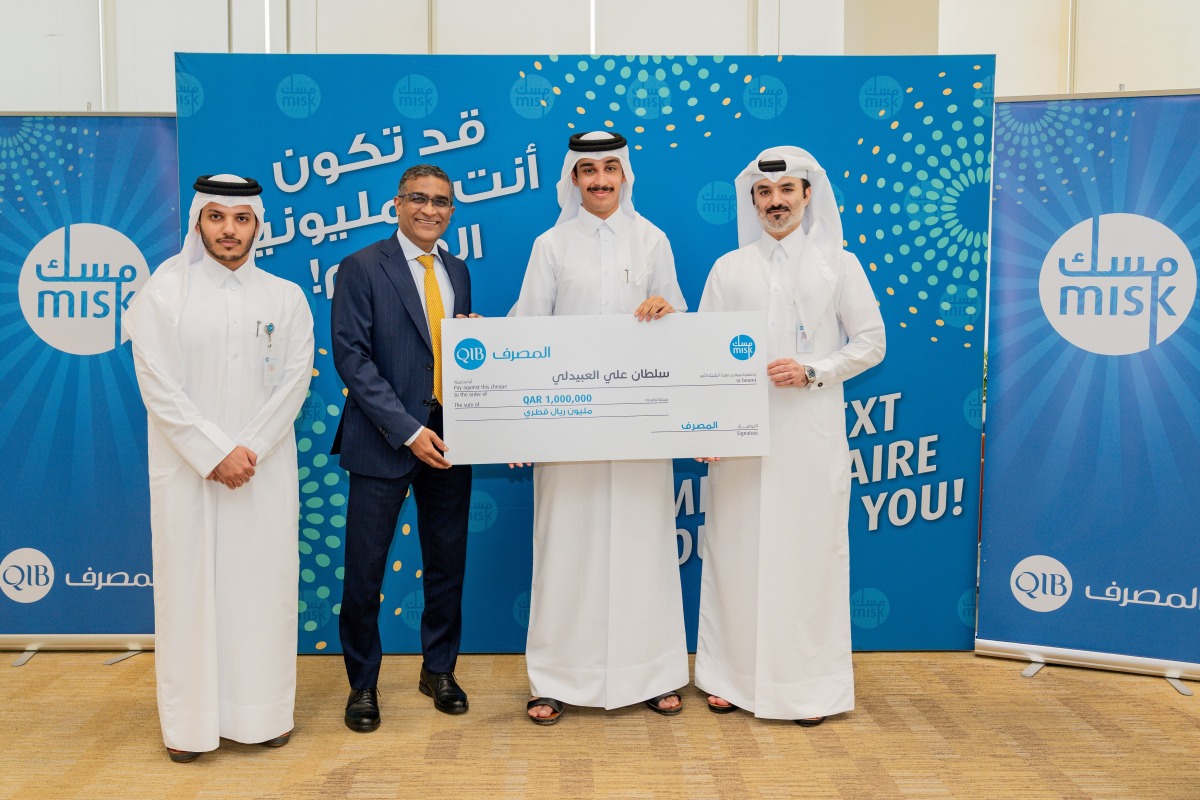 The winner receiving the prize from the officials.