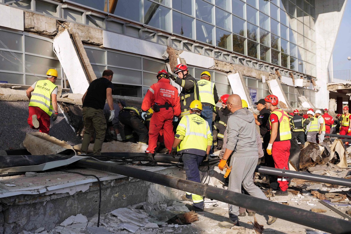 In this handout photograph taken on November 1, 2024 and released by the Ministry of Interior Affairs of Serbia and shows emergency and rescue teams working at the site where a concrete outdoor roof of a train station collapsed in the northern Serbian city of Novi Sad. Photo by MINISTRY OF INTERRIOR AFFAIRS OF SERBIA / AFP