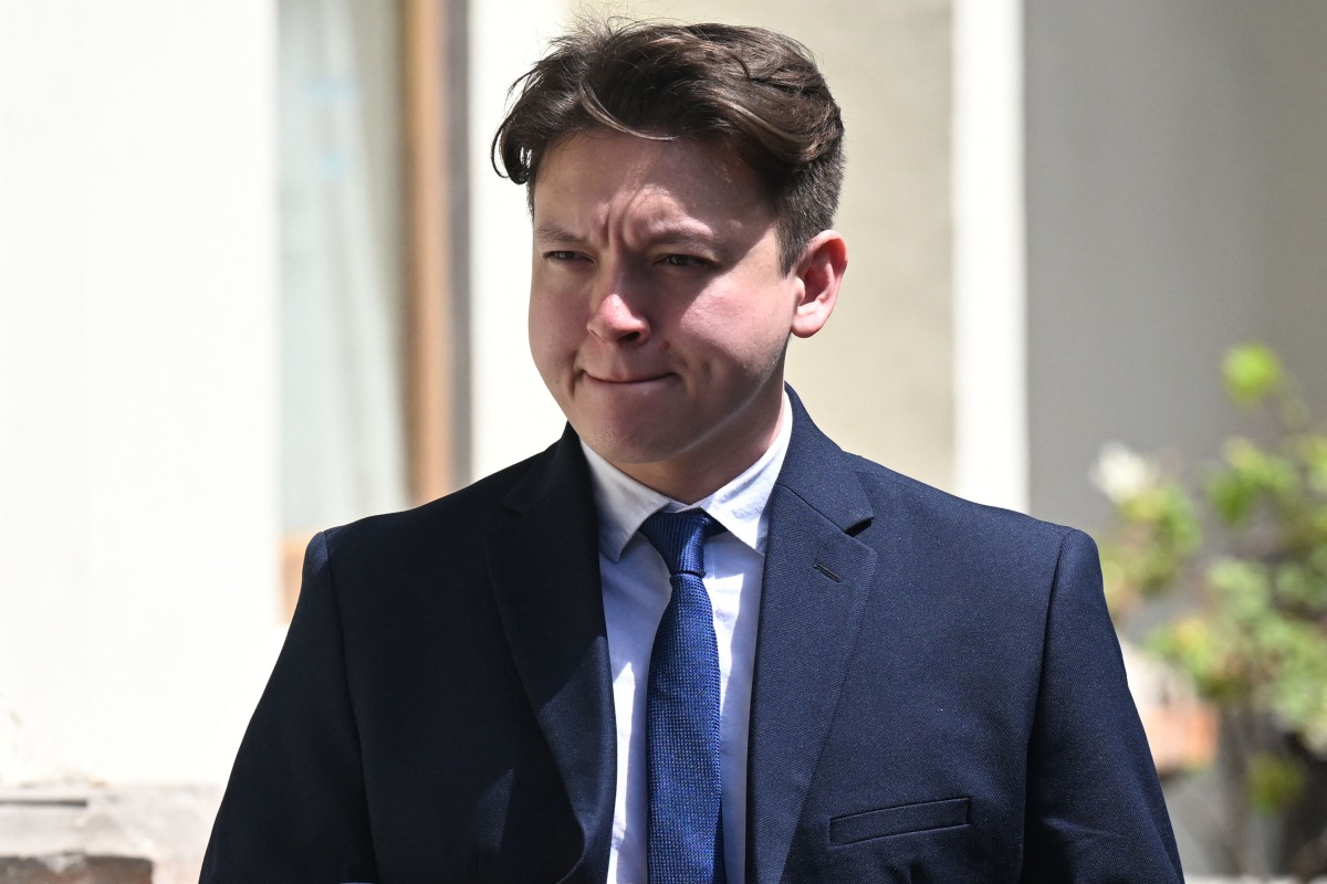 US national William Wallace Molyneaux walks to a court room during his trial in Denpasar, on Indonesia's resort island of Bali on August 5, 2025. Photo by SONNY TUMBELAKA / AFP