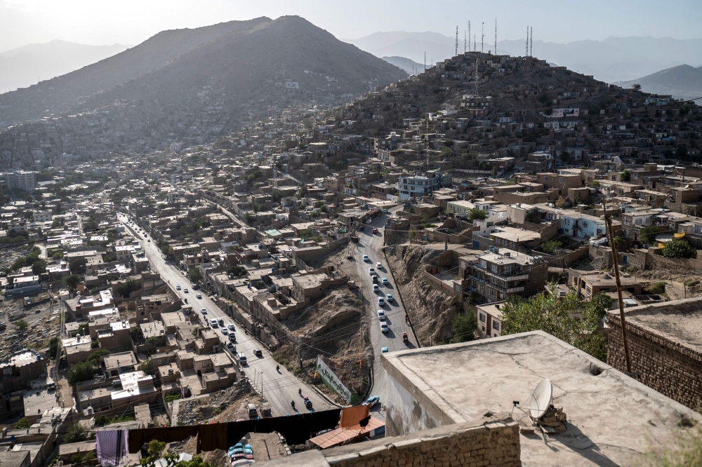 In this photograph taken on August 3, 2025, a general view shows the residential houses on a hillside in Afghanistan's capital, Kabul. (Photo by Wakil Kohsar / AFP)

