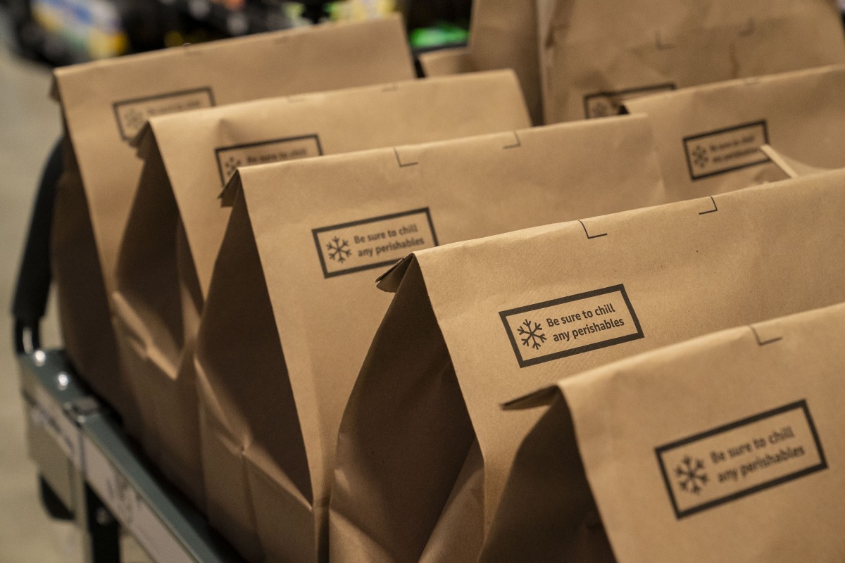 Packed customer orders at an Amazon Fresh grocery store in Seattle, Washington, US, on Thursday, May 2, 2024. Photo credit: David Ryder/Bloomberg
