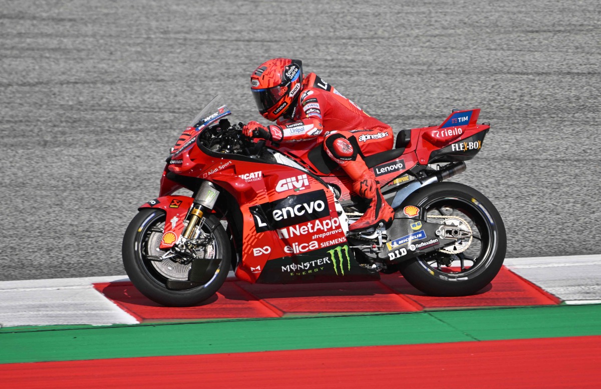 Ducati Lenovo team's Spanish rider Marc Marquez competes in the sprint race ahead of the Austrian MotoGP Grand Prix at the Red Bull Ring race track in Spielberg, Austria, on August 16, 2025. (Photo by Jure Makovec / AFP)
