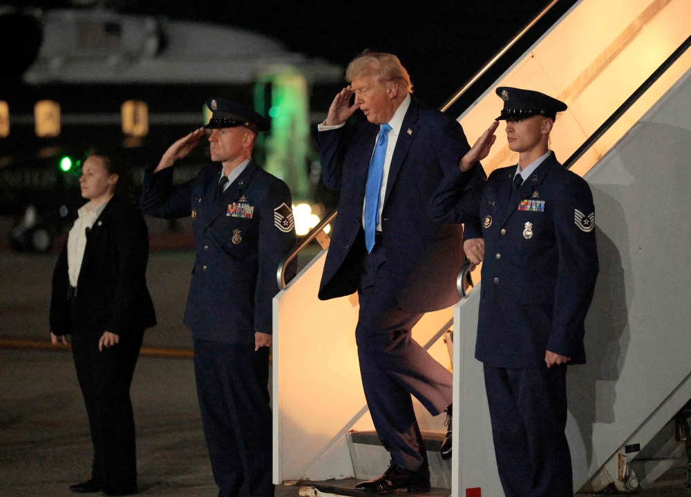 US President Donald Trump walks off Air Force One after arriving at John F. Kennedy International Airport on September 22, 2025 in New York City. Chip Somodevilla/Getty Images/AFP
