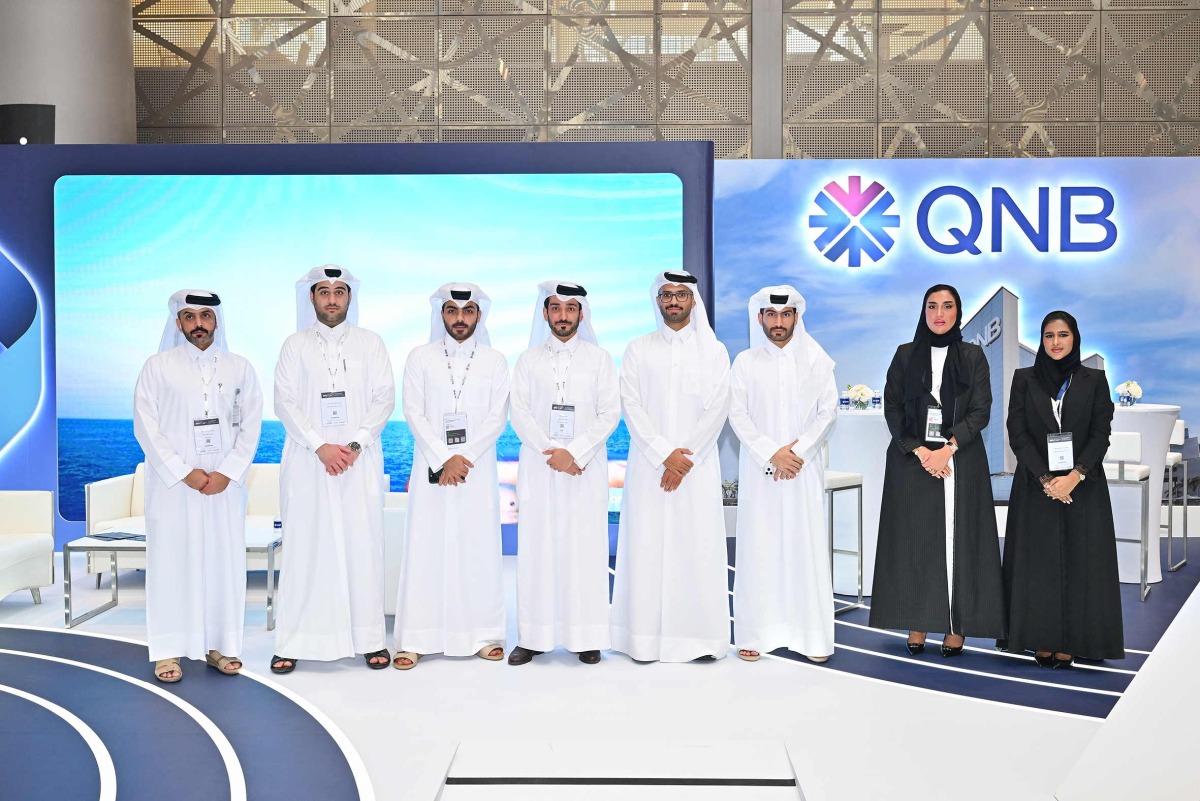 QNB officials pose for a group photo during the event.