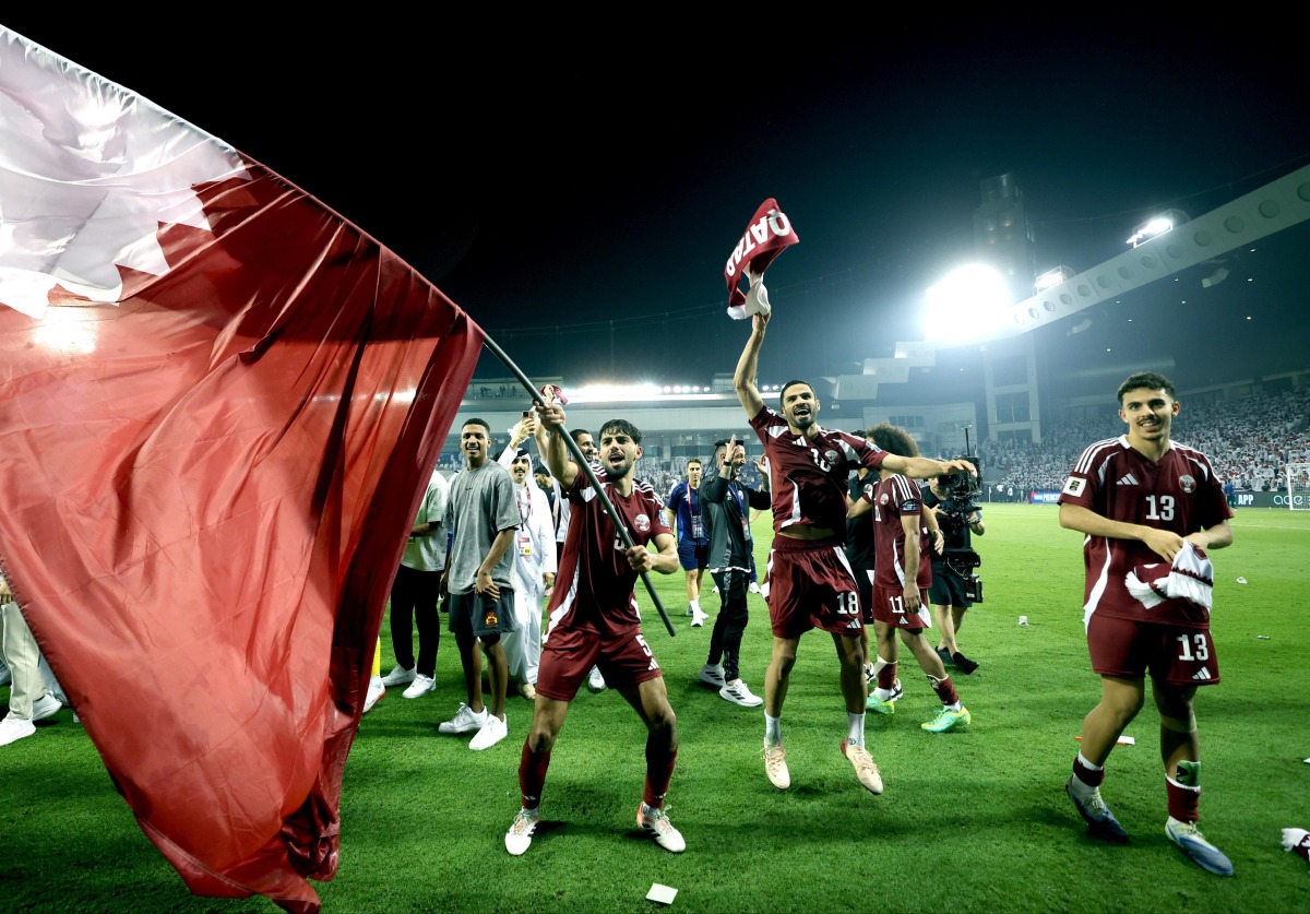 Qatar players celebrate after defeating the United Arab Emirates on Tuesday night to secure their qualification for the FIFA World Cup.
