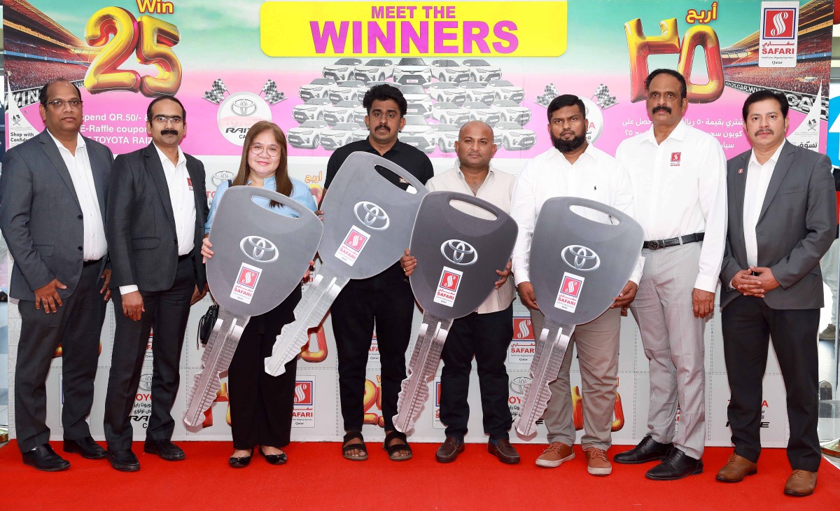 Safari Hypermarket officials with the winners of the promotion.