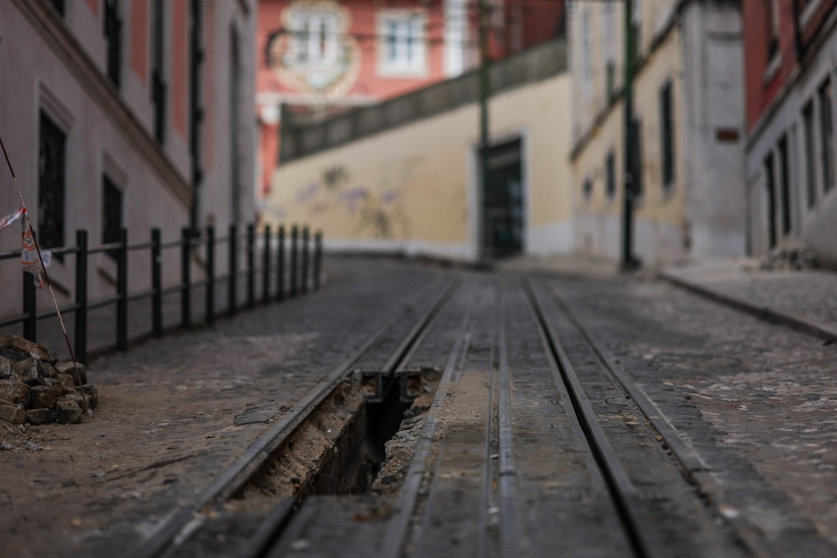 An excavation in the railway is pictured at the site of the Gloria funicular accident after the wreckage was removed in Lisbon on September 5, 2025. Photo by PATRICIA DE MELO MOREIRA / AFP