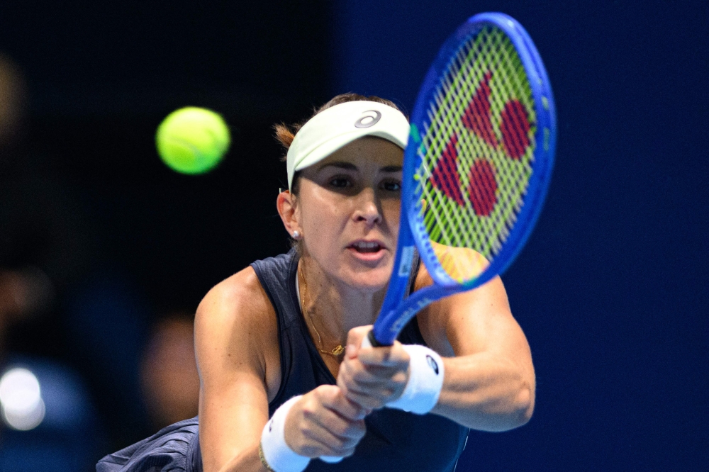 Switzerland's Belinda Bencic hits a return against Czech Republic's Linda Noskova during the women's singles final at the Pan Pacific Open tennis tournament in Tokyo on October 26, 2025. (Photo by Philip Fong / AFP)