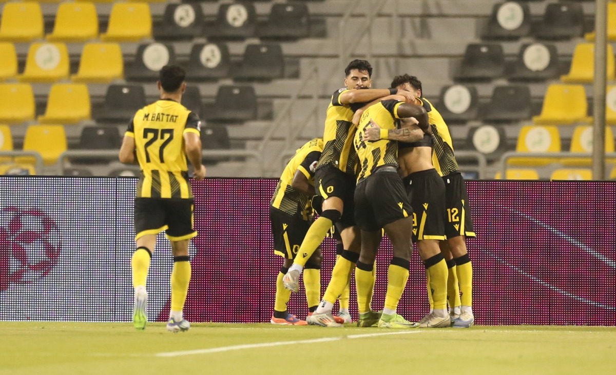 Qatar SC players celebrate with Joao Pedro after the Brazilian scored a goal against Umm Salal yesterday. 