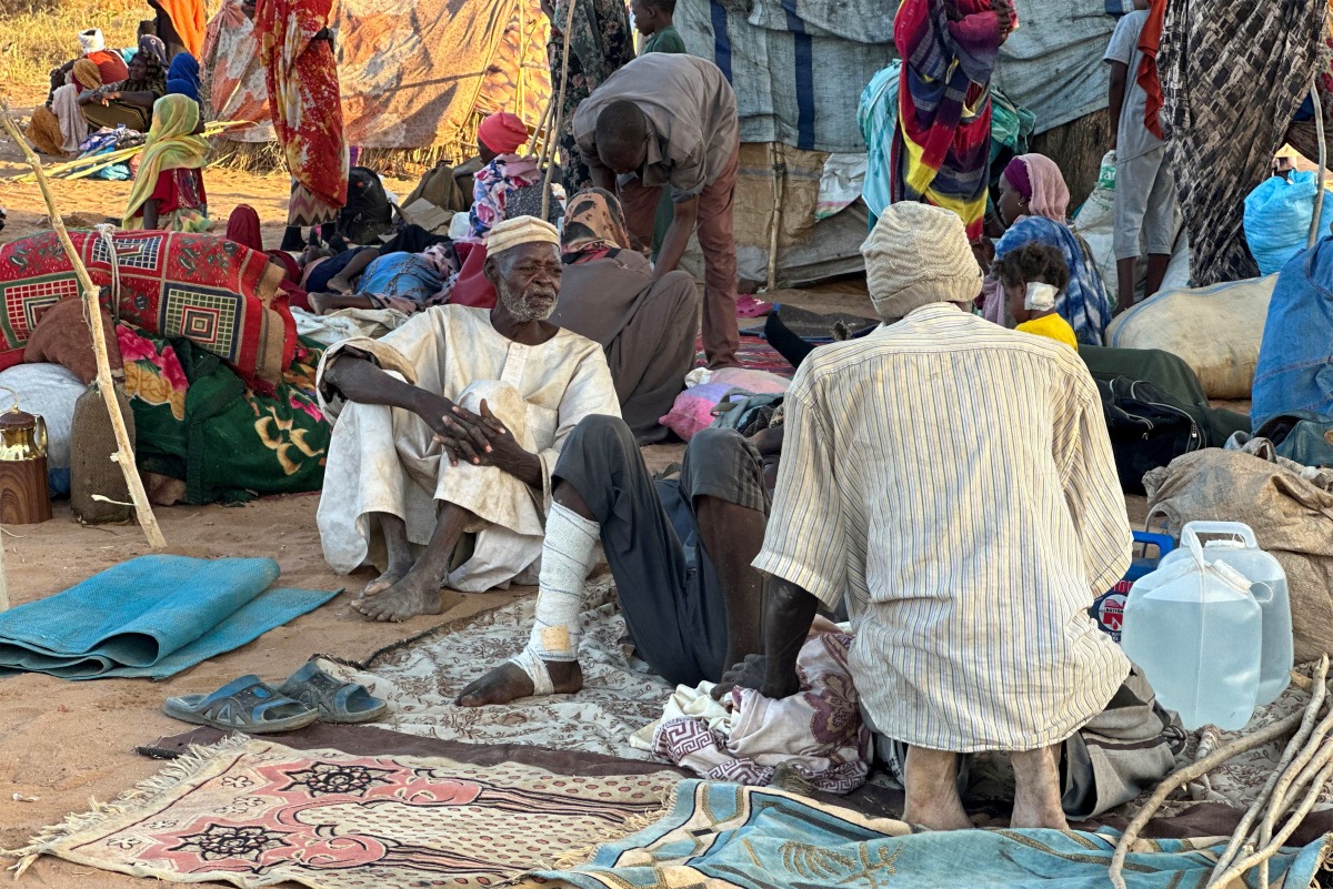 Displaced Sudanese who fled El-Fasher after the city fell to the Rapid Support Forces (RSF), rest near the town of Tawila in war-torn Sudan's western Darfur region on October 28, 2025. Photo by STR / AFP.