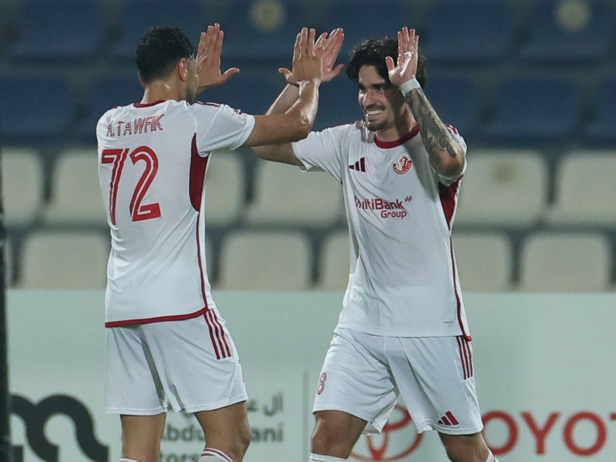 Al Shamal’s Alex Collado (right) celebrates with teammate Akram Tawfik Elhagrasi.