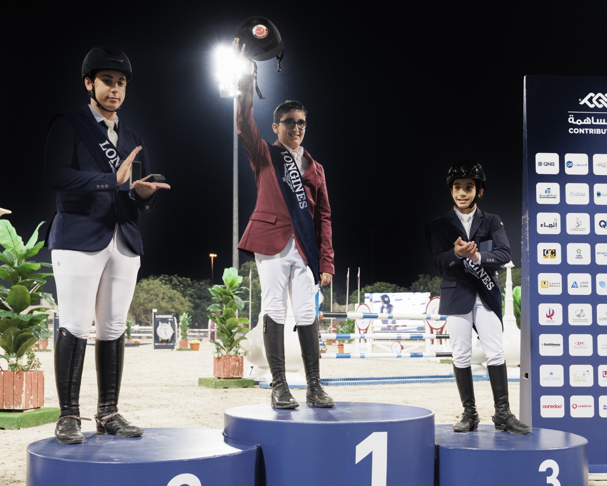 Young Riders Tour winner Khalifa bin Joaan bin Hamad Al Thani celebrates on the podium.