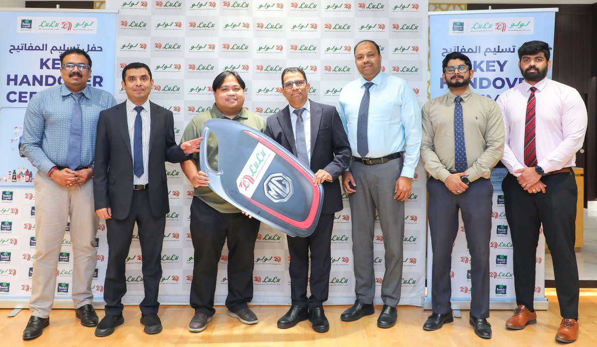 Regional Director of LuLu Shanavas Padiyath handing over the key to a winner.