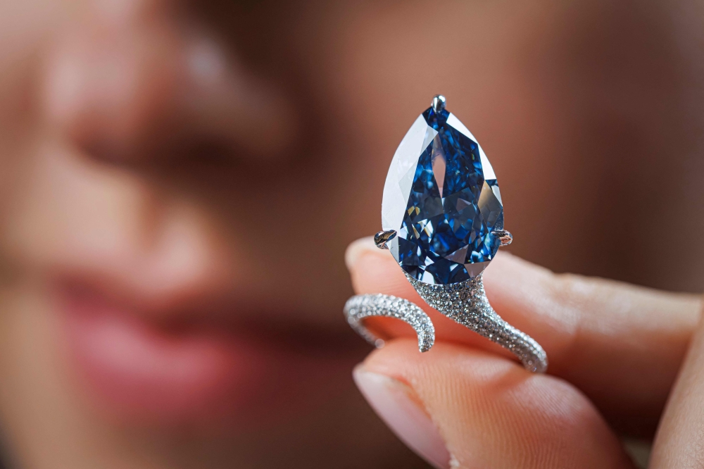 The 9.51-carat vivid blue diamond, known as “The Mellon Blue”, during its presentation at Christie’s auction house in Geneva. Photo by Valentin Flauraud / AFP