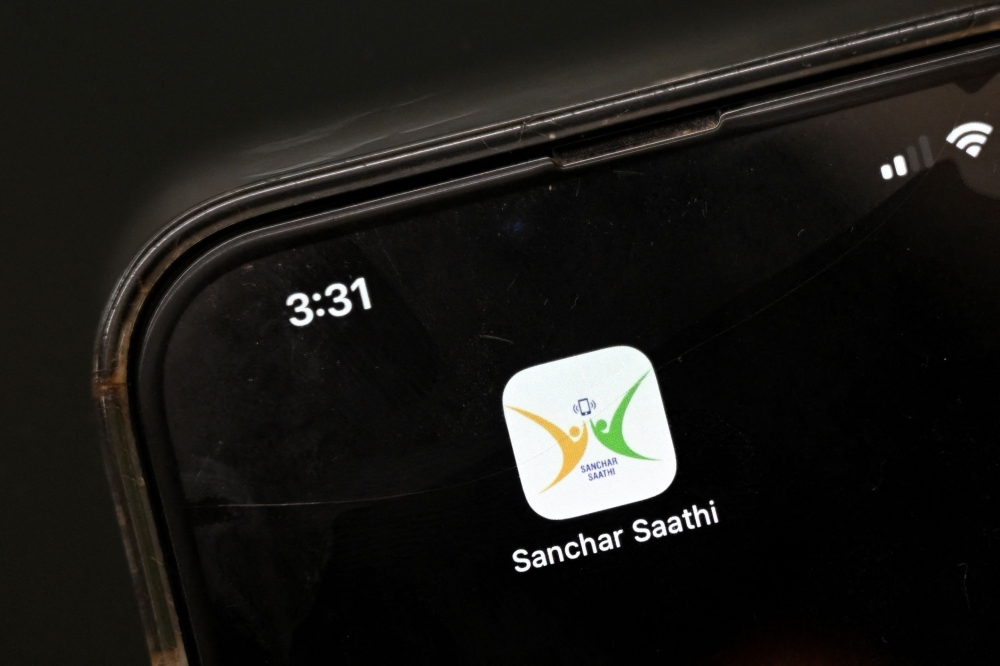 This photo illustration taken on December 2, 2025 shows the icon of the cyber safety application Sanchar Saathi on the screen of a smartphone in New Delhi. India has ordered smartphone makers to pre-install a government-run cyber security app that cannot be removed, a move that has raised concerns about users' privacy. (Photo by Sajjad Hussain/ AFP)