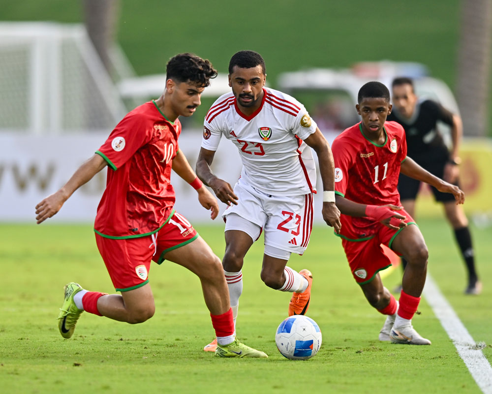 Action during the match between UAE and Oman.