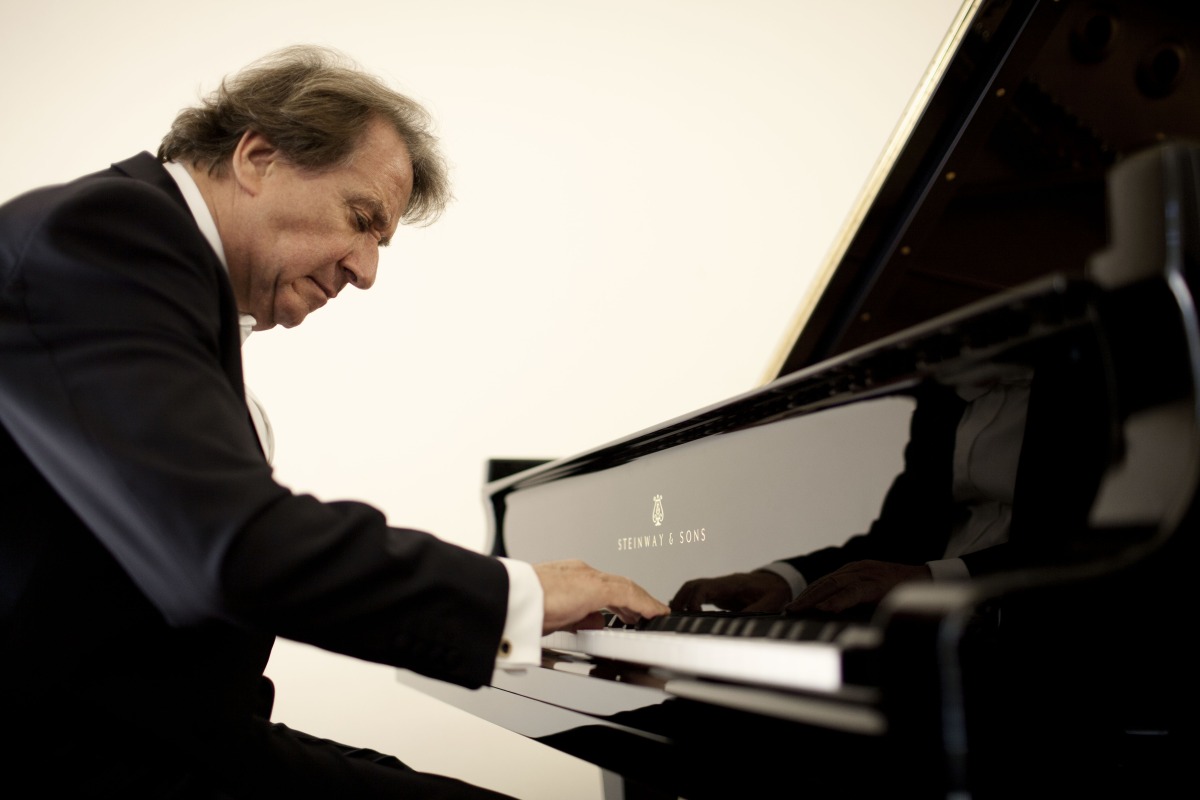 Rudolf Buchbinder playing the piano. 