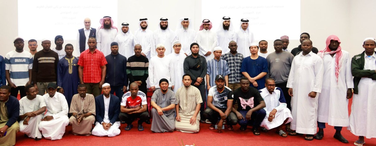 Officials with participants during the honouring ceremony. 