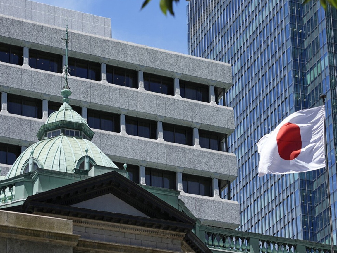 Bank of Japan keeps policy rate unchanged, lowers forecast for economic growth