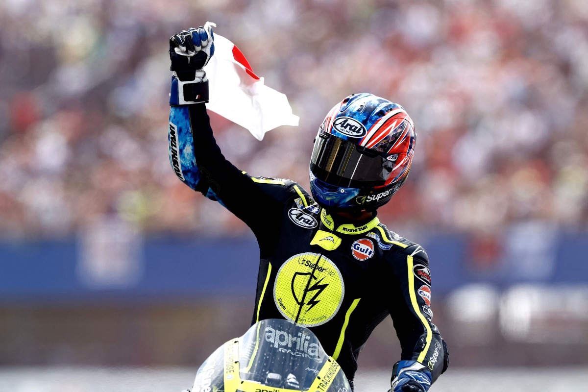 Japan's Ai Ogura reacts on his Aprilia after the MotoGP race during the 95th edition of the Dutch Motorcycle Grand Prix at the TT Circuit Assen, in Assen, on June 28, 2026. (Photo by Vincent Jannink / ANP / AFP) 