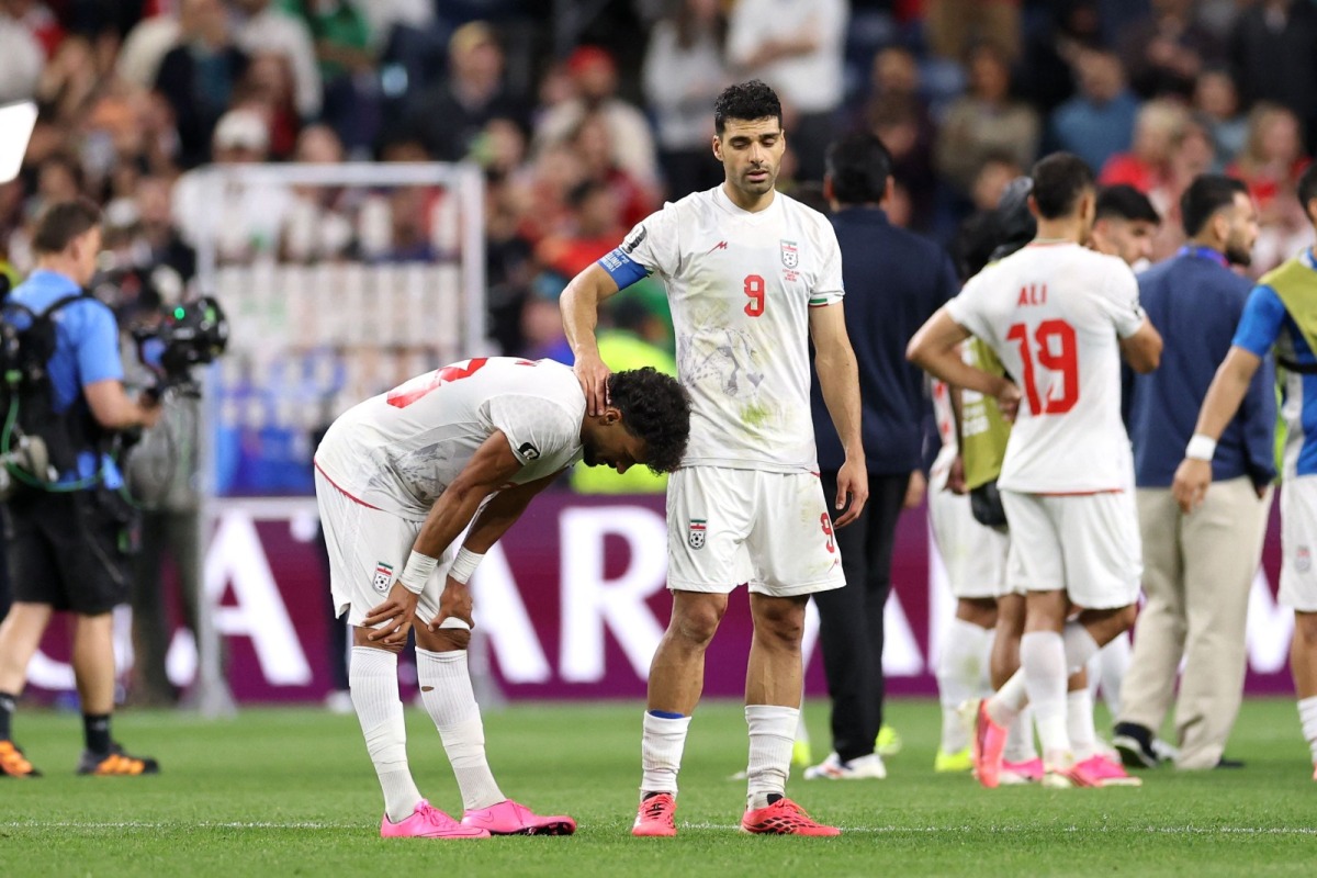 Ramin Rezaeian (left) and Mehdi Taremi of Iran react after the 1-1 draw against Egypt. PIC: AFP