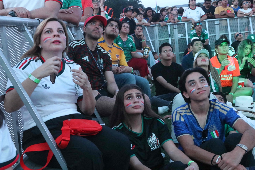 Football fans react at the FIFA Fan Fest during the 2026 FIFA World Cup football match between the Netherlands and Morocco at Parque Fundidora in Monterrey, Mexico, on June 29, 2026. (Photo by Julio Cesar Salazar / AFP)
 